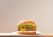 © ADDICTIVE STOCK - Delicious cheeseburger with lettuce, tomato, and onion on a wooden table