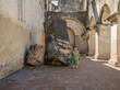 © SALMONNEGRO - Beautiful baby walks through the corridors of a ruined convent and her mother takes a photo of her.