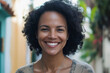 © NPix - Smiling Brazilian Woman with Curly Hair in a Sunny Outdoor Setting
