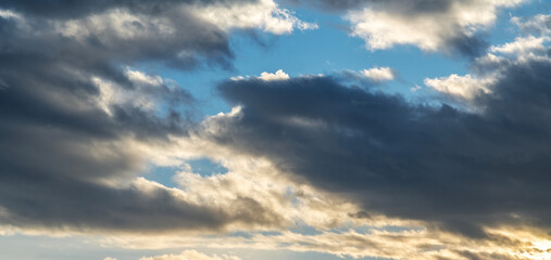 Wall Mural - sunset sky background. beautiful bright sunset sky with clouds.