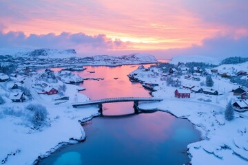 Wall Mural - Pink dawn illuminating snowy norwegian village, aerial view of bridge over fjord