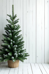 Wall Mural - a beautiful christmas fir tree is adorned with a pine branch decoration on a snowy white wooden back