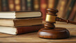 © mahamad - A wooden gavel and books arranged on a wooden table, symbolizing law.
