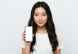 © Anomal - Mockup image of a beautiful woman woman holding and showing smartphone or mobile phone with blank white screen