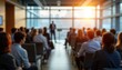 © miss irine - Business seminar in progress. Attendees listen to speaker. Blurred view of people in a meeting room. Event takes place indoors. Modern office setting. Pro development. Learning in progress.