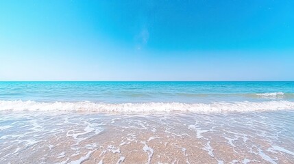 Poster - Serene beach scene with calm waves and clear blue sky.