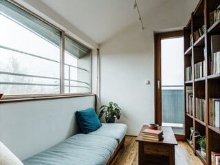 Poster - Cozy Reading Nook With Natural Light and Wooden Bookshelves in a Modern Home. Generative AI