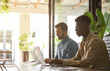 © insta_photos - Business team of two busy successful professional business men executive working together in office using laptops computer technology managing data sitting in corporate office.