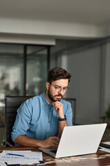 busy professional business man employee, young businessman software engineer looking at computer thi