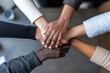 © Odin AI - Collaboration and teamwork among diverse hands, symbolizing unity and support in a professional environment