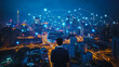 © Teeraphon - Smart digital Innovation city with connection network reciprocity over the cityscape. of future smart wireless city and social media networking systems that connects business people with in city