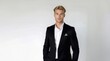 © Volodymyr - Handsome blonde Man portrait. Man in suit, attractive businessman, business style. Portrait of a guy in an expensive business suit.