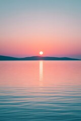 Wall Mural - A serene sunrise over the horizon, with pastel colors reflecting on the calm water. The sky is a gradient of soft pinks and blues, creating an atmosphere of tranquility and hope
