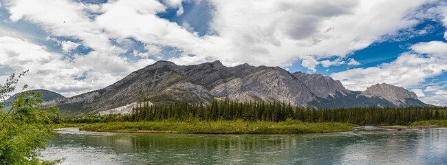 Sticker - Majestic mountain panorama with river reflection.