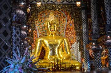 Wall Mural - Golden Buddha, Buddhist symbols at Watsridonmoon, symbols of Buddhism, Southeast Asia at Chiangmai Northern Thailand