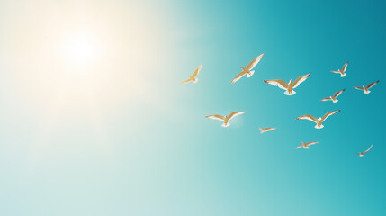 Wall Mural - flock of seagulls soaring under a clear blue sky with sunlight creating an ethereal effect