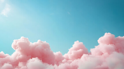 Wall Mural - soft pink clouds contrasting against a clear blue sky during the day