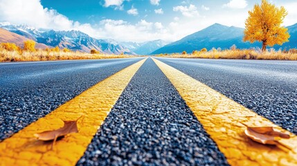 Sticker - Scenic autumn highway with yellow lines leading to mountains.