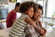 © NDABCREATIVITY - Caring african american mother hugging teenage daughter, enjoy moment of love, motherhood concept