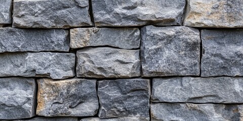 Poster - Textured background featuring a gray stone wall, showcasing the natural patterns and surfaces of the gray stone wall that creates an interesting visual appeal for various design projects.