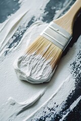 White brush on black surface