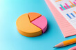 © JK_kyoto - Colorful pie chart on blue background with report and pencil nearby, showcasing data visualization