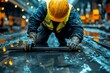 © Design By Reiga - A construction worker in a yellow hardhat kneels, carefully cleaning a wet metal bar on a construction site.