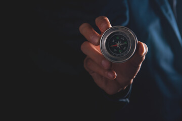 Wall Mural - male hand holding compass .