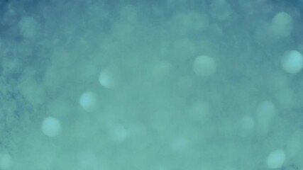 Abstract festive silver blue bokeh background.
Circles are slowly flying, seamless loop animation,4K