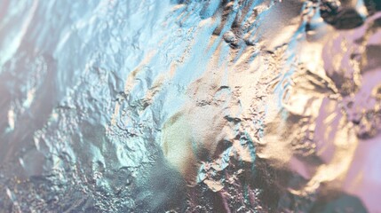 Poster - A close-up view of textured metallic surface reflecting light in various hues.