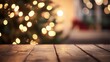 © Solo - Wooden table under festive pine branches with Christmas decorations and lights in the background creating a warm holiday atmosphere