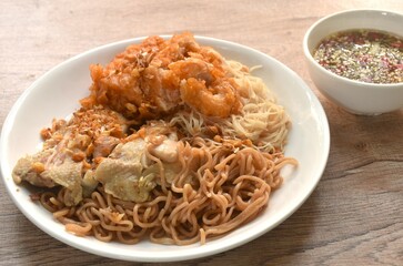 Wall Mural - slice boiled and fried chicken dressing instant noodles and rice vermicelli topping garlic on plate dipping spicy seafood sauce