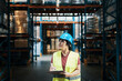 © Davor - Female warehouse worker inspecting inventory with clipboard