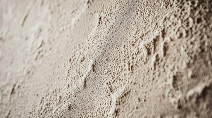 Aufkleber - Close-up of a textured wall surface showcasing a rough, uneven finish.