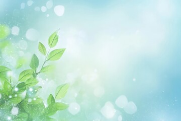 Fresh green leaves with light bokeh on a soft blue background