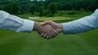 © Vasiliy - Business handshake on golf course with forest background. Partnership agreement concept