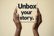 © Cik In - Hands Holding a Light Beige Box with Bold Text Saying 'Unbox Your Story' Against a Plain Background for Creative Branding and Marketing Concepts