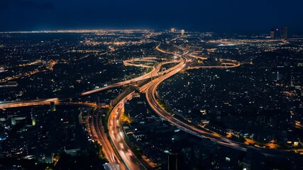 Poster - Dynamic city night traffic viewed from an elevated perspective in a bustling metropolitan area