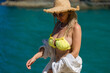 © руслан малыш - Blonde woman with big breasts in a yellow swimsuit on the beach. Portrait of a young woman with a beautiful body. Sexy model showing bra