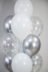 Wall Mural - bouquet of white and silver balloons for a holiday, birthday card with balloons