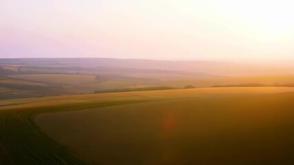 Aufkleber - Exploring the serene landscapes of rolling hills and fields at dusk