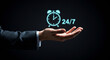 © Shanewaz - High-quality image featuring a business hand holding a glowing 24/7 clock icon, ideal for projects emphasizing continuous service, customer support, and round-the-clock availability