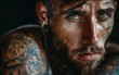 © Ahsan Raza - A close-up portrait of a man with striking tattoos showcasing intricate designs