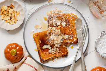 Wall Mural - Pumpkin French Toast with Maple Syrup, Almonds and Powdered Sugar