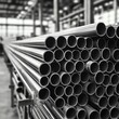 © Nigar - Closeup of Piled Steel Pipes in Industrial Warehouse