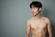 © Vibudhaart - A shirtless man with short black hair looks to the right.