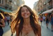 © Vibudhaart - A joyful young woman with long brown hair laughs brightly while walking down a sunlit city street.