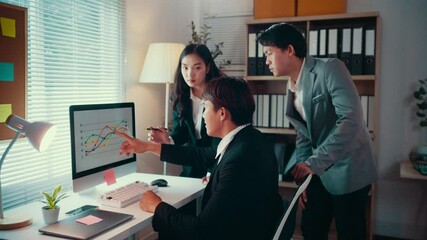 Fototapete - Business professionals collaborating, analyzing financial graphs on computer screen, discussing strategic data insights within modern corporate workplace environment