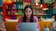 © WS Studio 1985 - Young Asian Woman Engaged in Remote Work in a Colorful Office Space