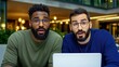 © A4719 - Two surprised men with glasses are looking at a laptop in a modern environment, expressing shock and curiosity.